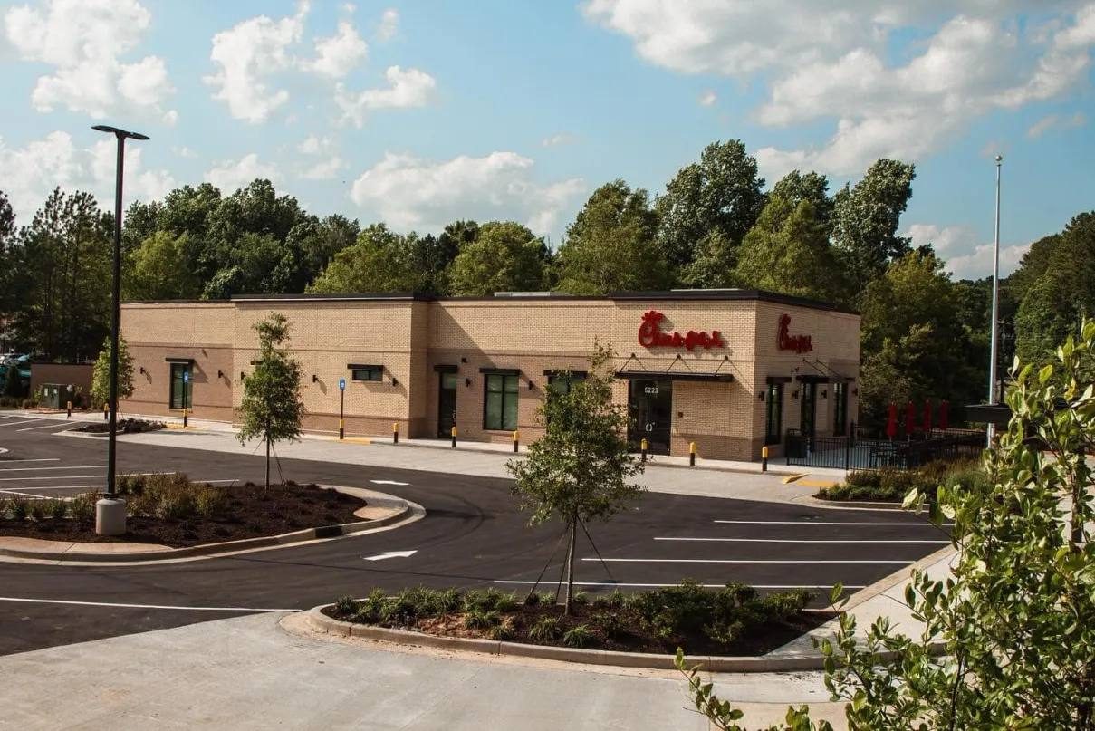 Brick retail building with landscaped parking lot
